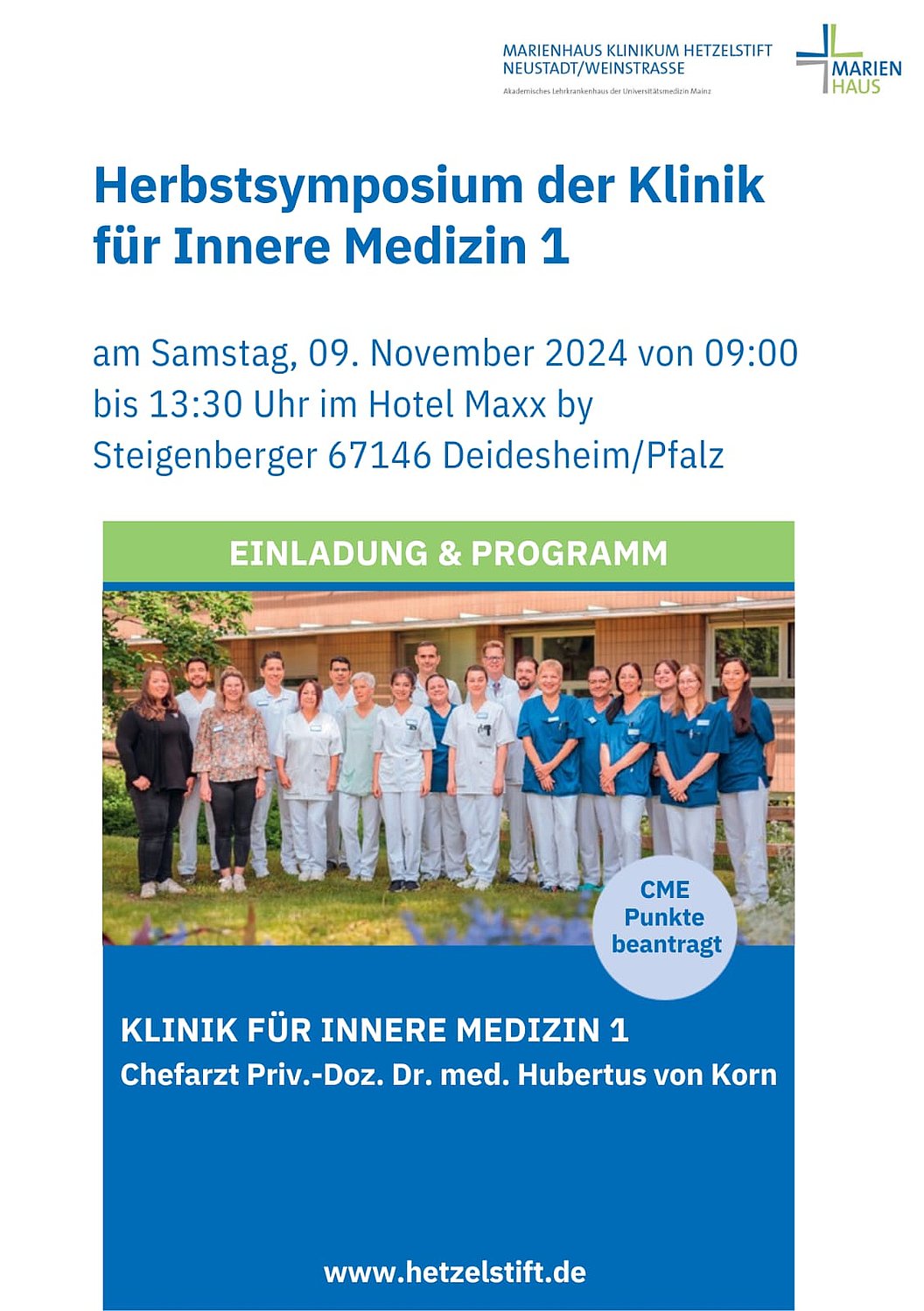 Gruppe von medizinischem Personal in weißer und blauer Arbeitskleidung vor Klinik, Einladung zum Herbstsymposium der Klinik für Innere Medizin 1 am 9. November 2024 in Deidesheim, Chefarzt Dr. Hubertus von Korn